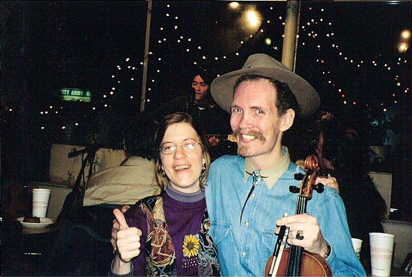 Andy with his violin. A computer professor and a dear friend. Here, on the open stage with me at one of my favorite places, the Gingko Coffee House.&nbsp; One night, we sat down and played on the computer with a couple of mics.