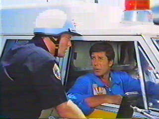 Image of brackettinambulancescenerunwithcop.jpg