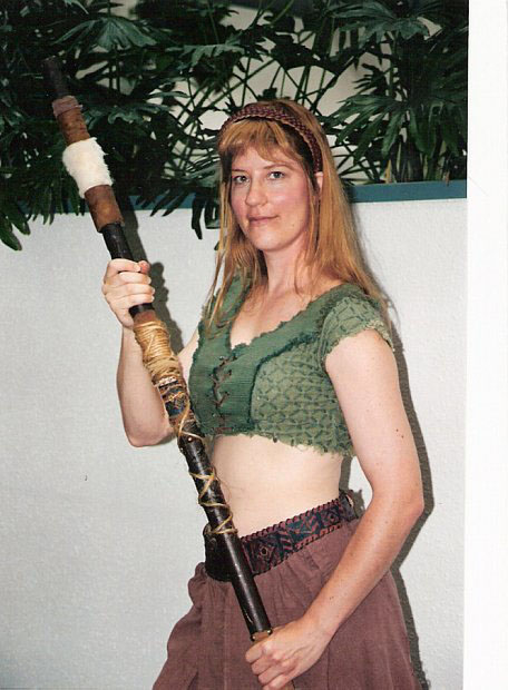 The irrascible Gabrielle, Xena's side kick. I made this costume out of placemats, a man's shirt and green denim jeans. The staff, I made from watching videos of the Xena series. The director liked the look so much, he let me wear this in the show's final scenes of my character escaping the dream world.