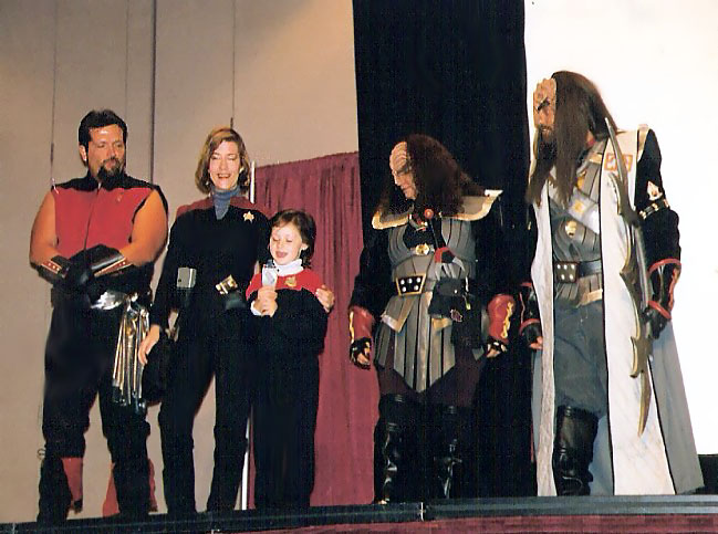 One of the most worked agency Star Trek characters I got to do was for Captain Janeway. I had to develop a speaking AND singing voice for this role for convention appearances. See song listing. Janeway Demo.