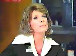 Image of dixieatdeskohbusinesssuitleft.jpg